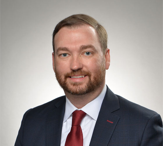 Image of smiling man in suit, who is Ken Crews, Corporate Vice President and Chief Financial Officer, Northrop Grumman Corporation