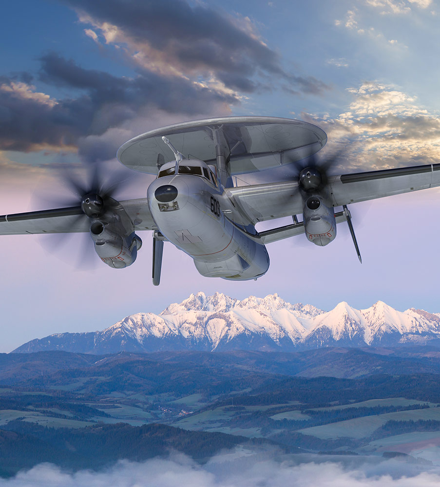 military plane above clouds and snow-capped mountains