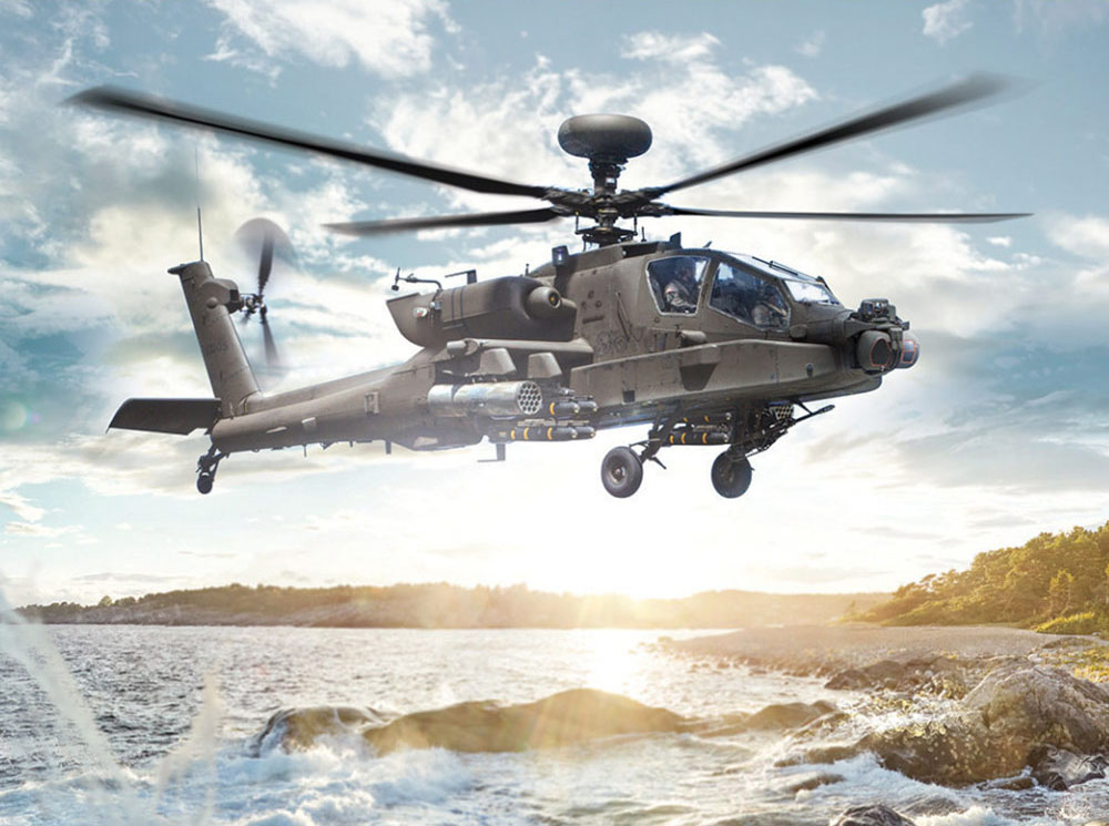 military helicopter flying low above water