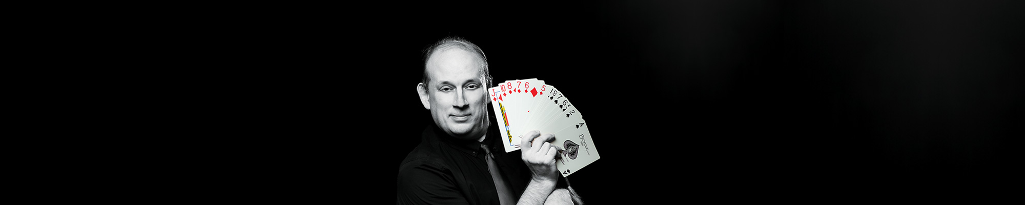 male with a deck of cards