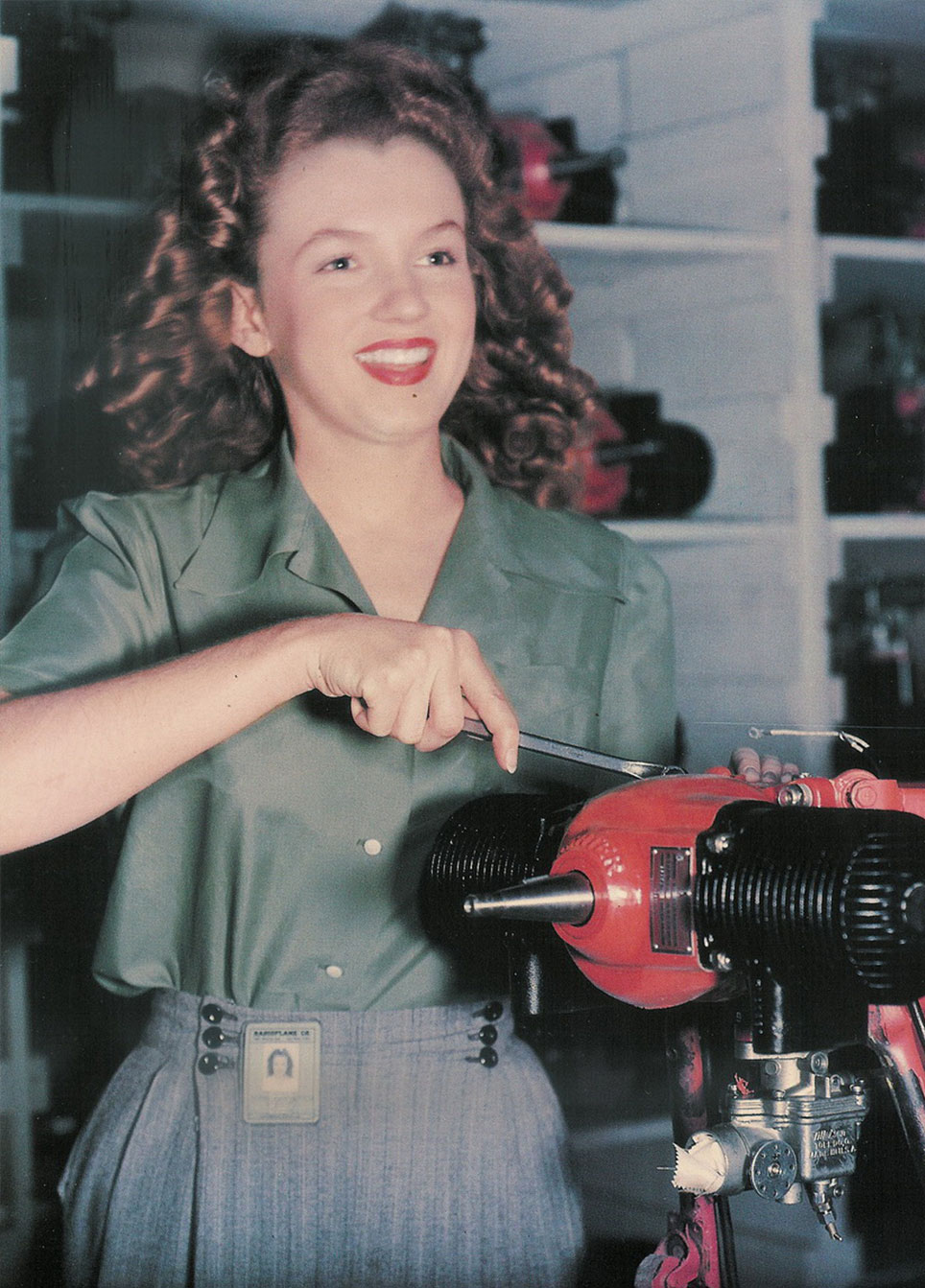 Photo of woman working in world war II airplane factory. 