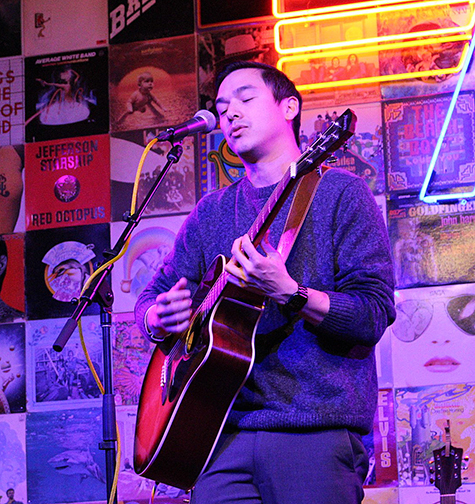 male playing guitar