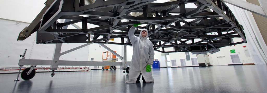 technician working on a telescope