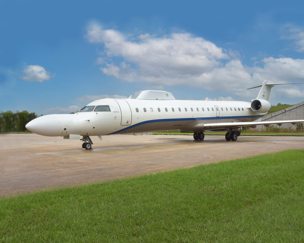 Each of Northrop Grumman’s three CRJ-700s has a number of modular, reconfigurable parts. CRJ-700 jet on runway