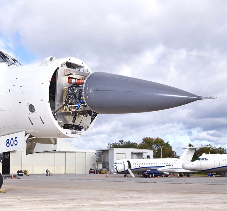 SABR radar installed on Test plane radar in nose of jet outside hanger