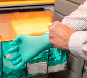 Image of clean room glove being put on.