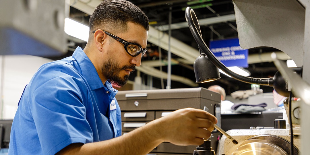 Melvin Aguirre works on equipment.