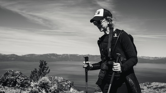 black and white photo of woman hiking