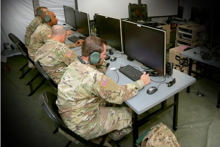 US_Army_Integrated_Air_Missile_Defense_Battle_Command_System_C4ISR_Northrop_Grumman Army soldiers sit at desk on computers