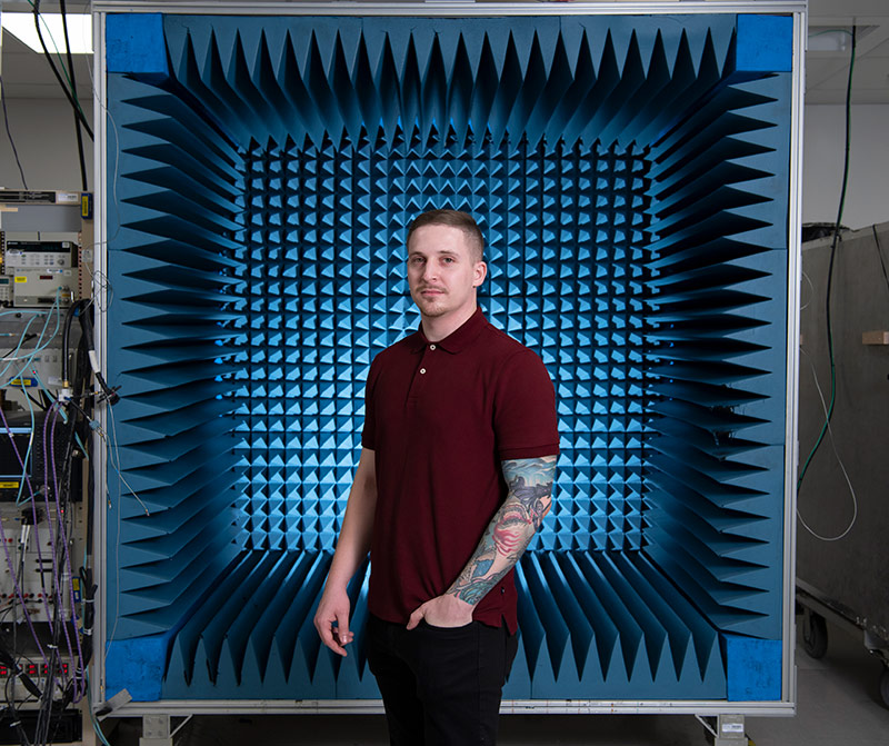 man standing in front of radar