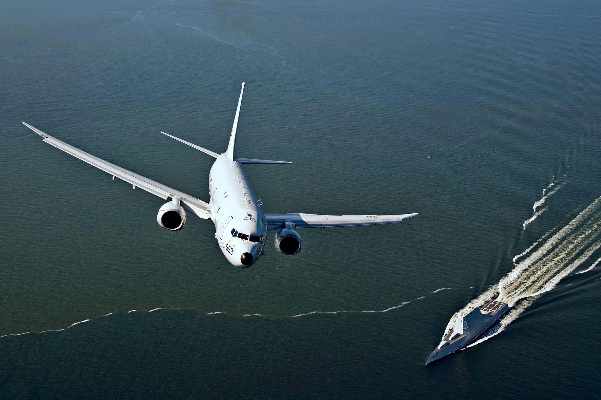 Busting Myths about Military Technology and the Electromagnetic Spectrum An aircraft flies over a boat in the Chesapeake Bay.
