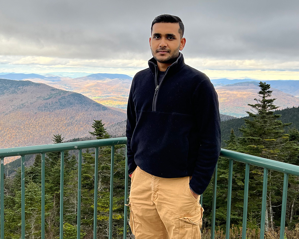 Man standing on stop of mountain