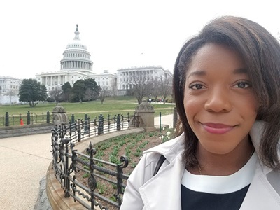 Black woman in front of White House