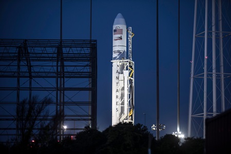 The Antares rocket lit up before sunrise