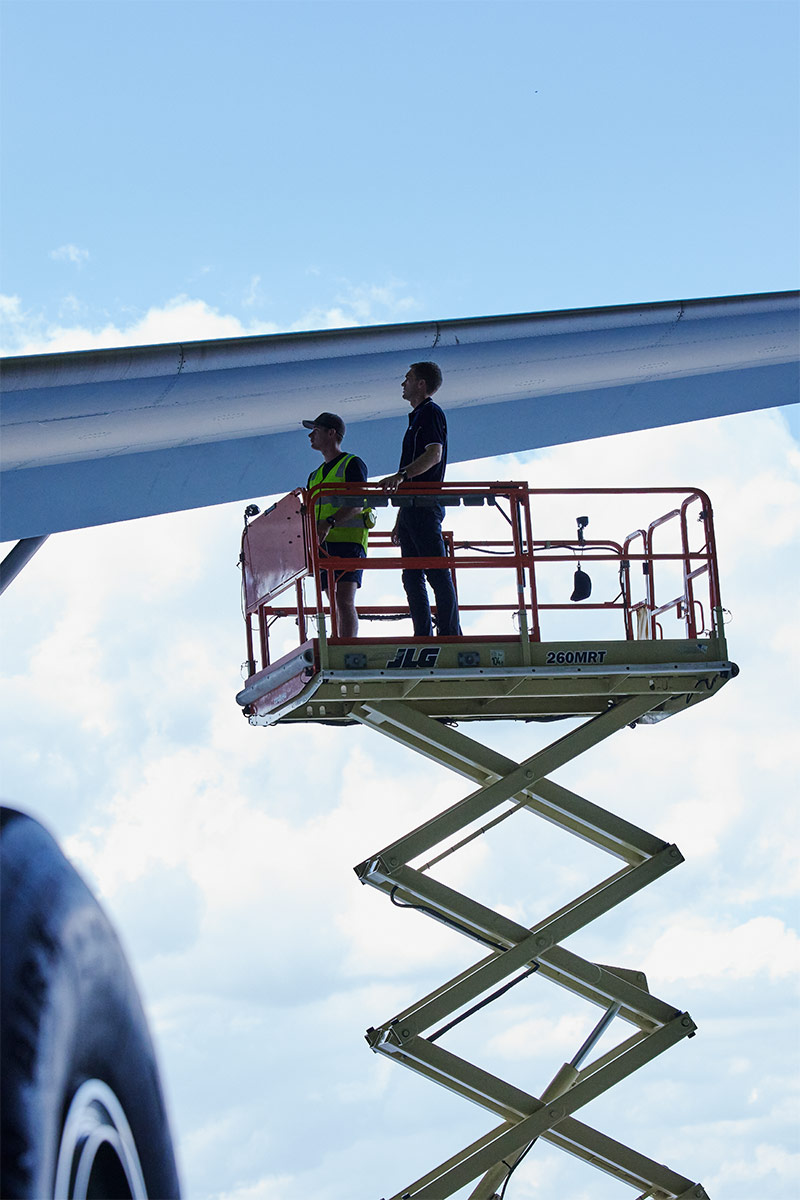 two people on scissor lift