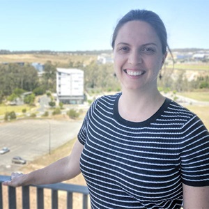 White female standing against a railing