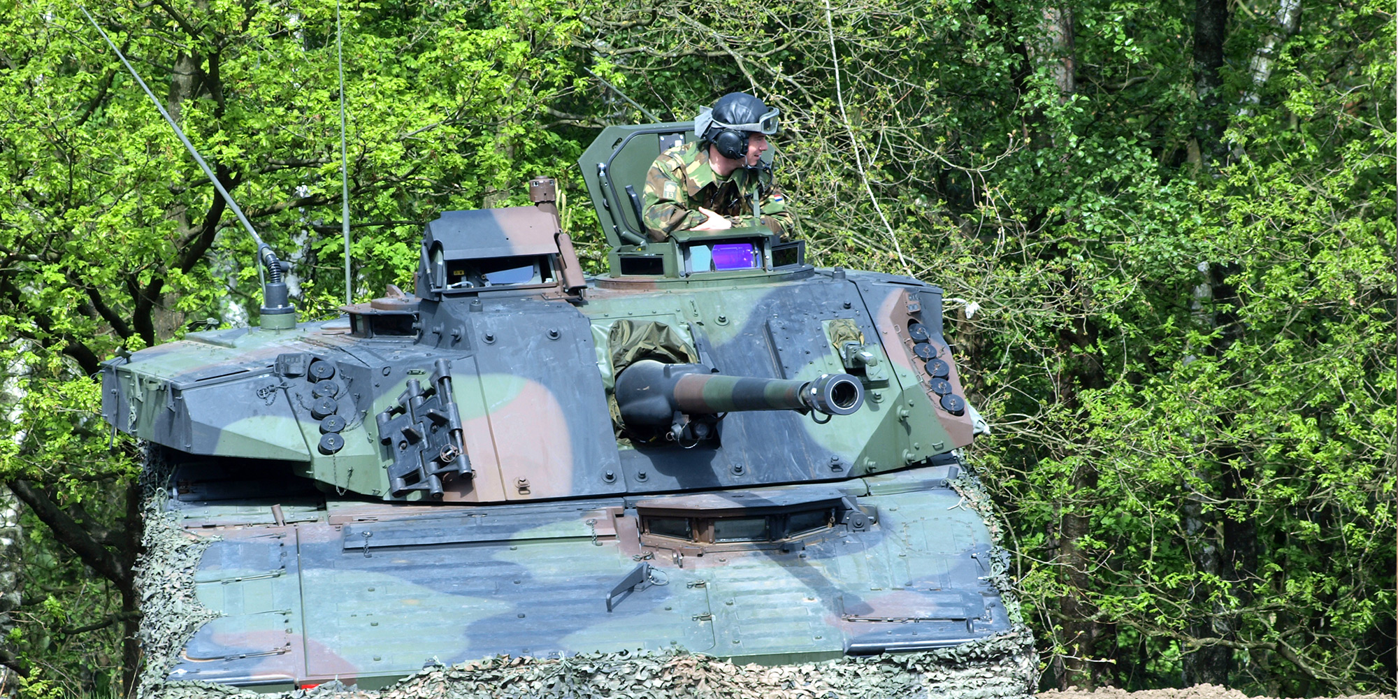 man in tank with Bushmaster III Bushmaster® Chain Gun®