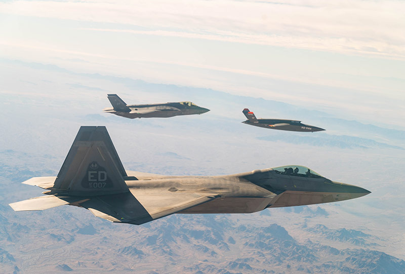 F-16's jet flying over mountains