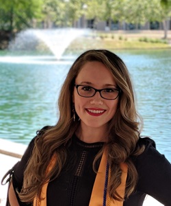 Young female posing with both hands on hips