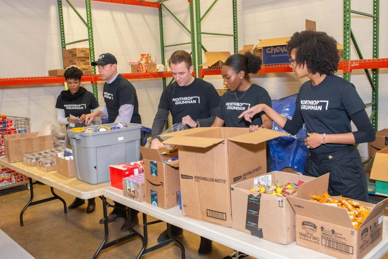 employees volunteering at a food bank