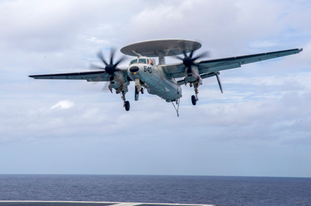 Military aircraft landing on carrier deck