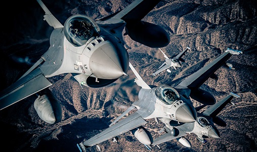 F-16's jet flying over mountains