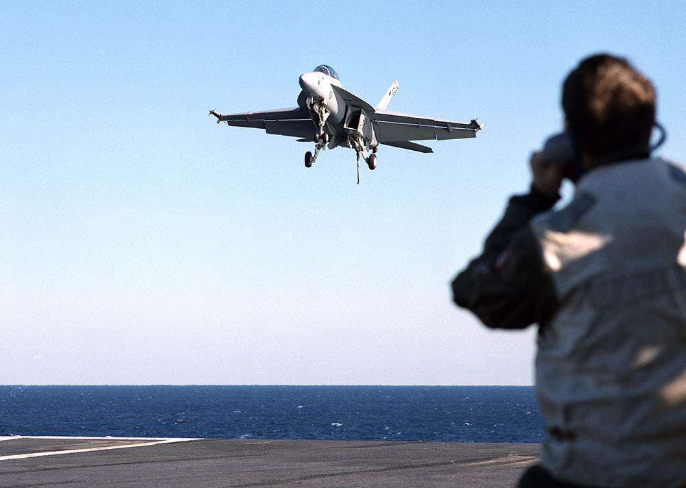F/A-18 landing on the deck of an aircraft carrier