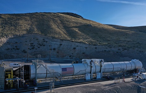 A rocket motor at test site preparing for static test firing in front of mountains