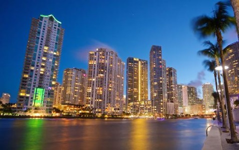 view of city buildings at sunset