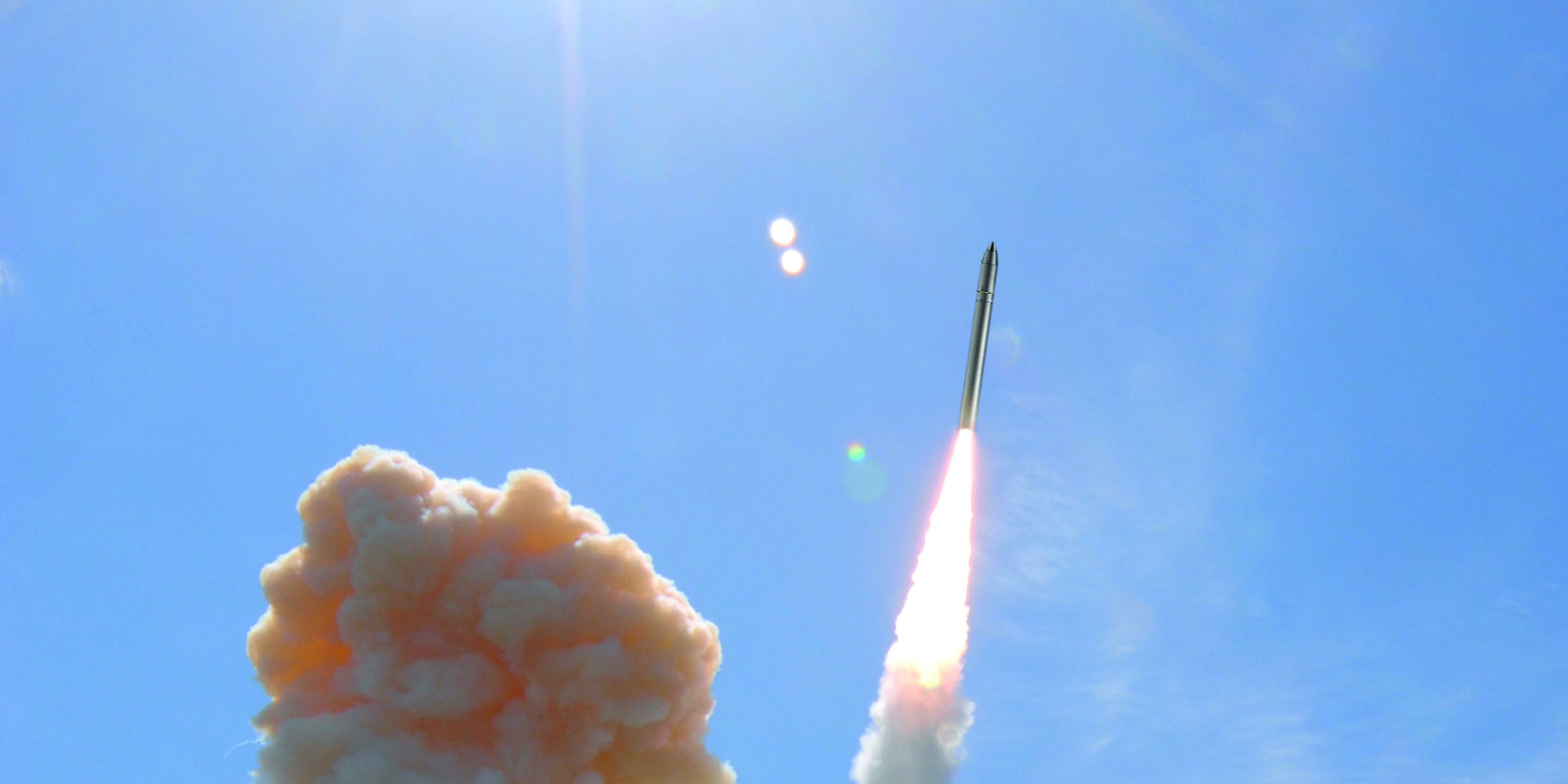 missile launch in clear blue sky