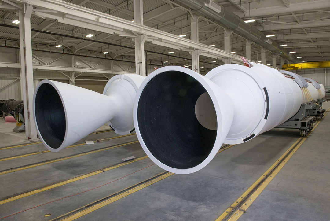 Two white large rocket motor boosters at the Promontory, Utah, facility