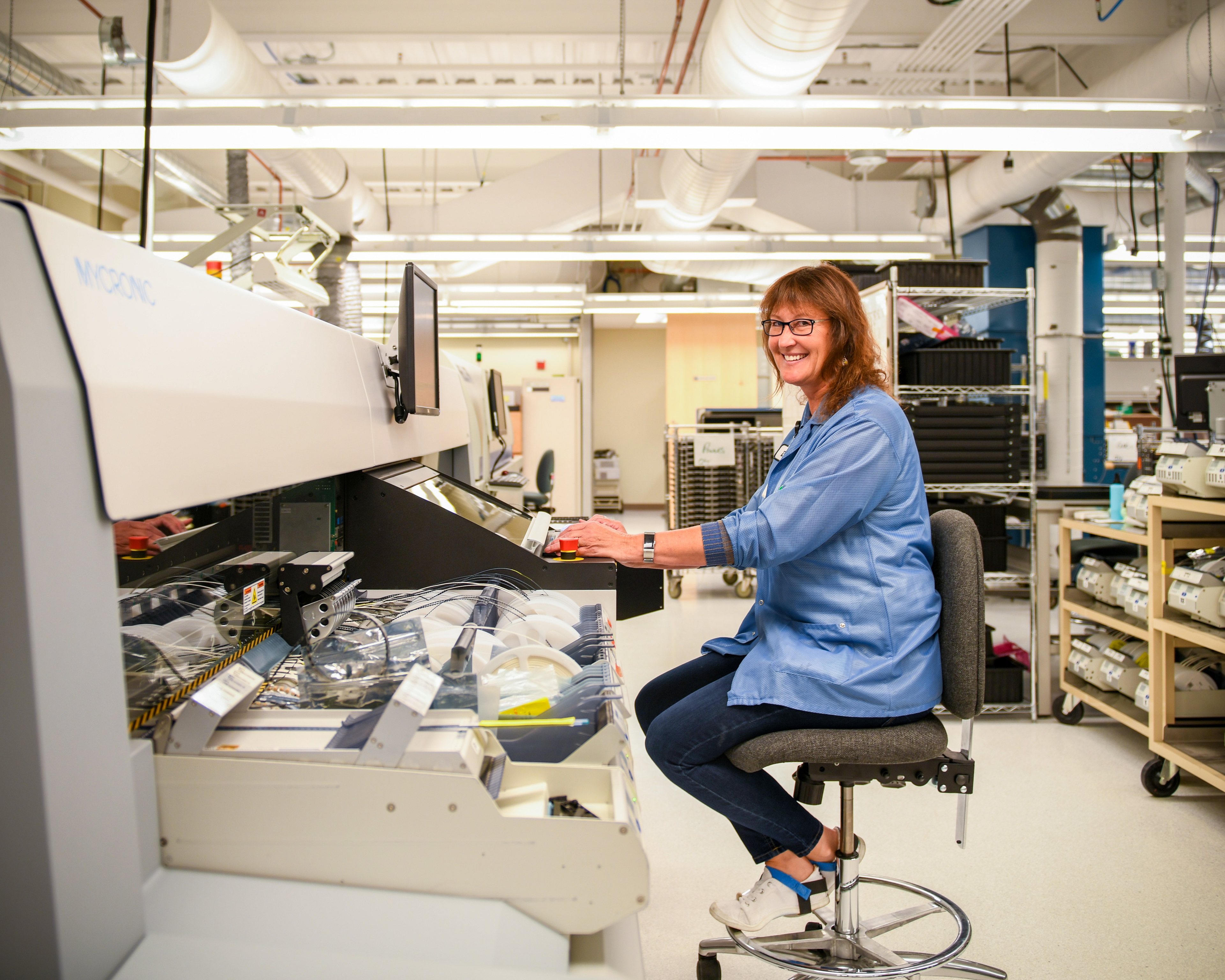 female working at desk in lab setting