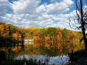 A house reflects on a lake in Huntsville, Alabama