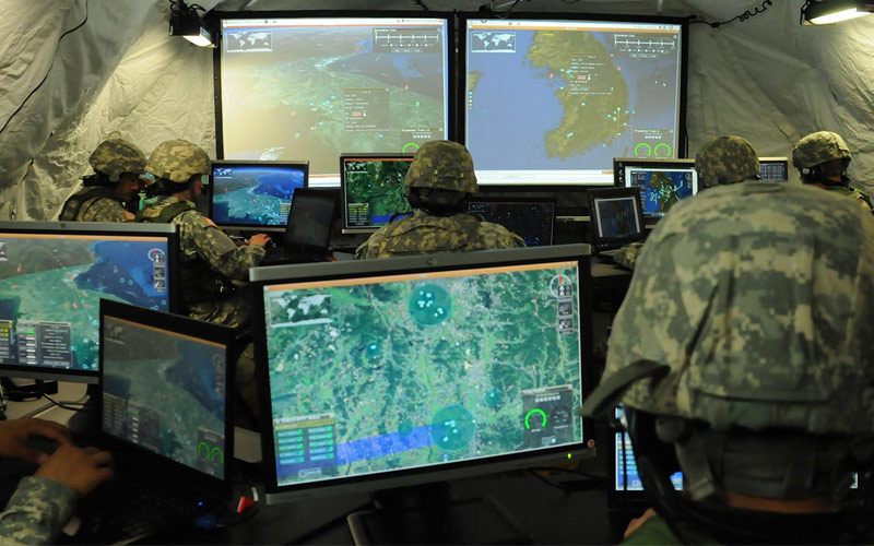 soldiers in tent on computers