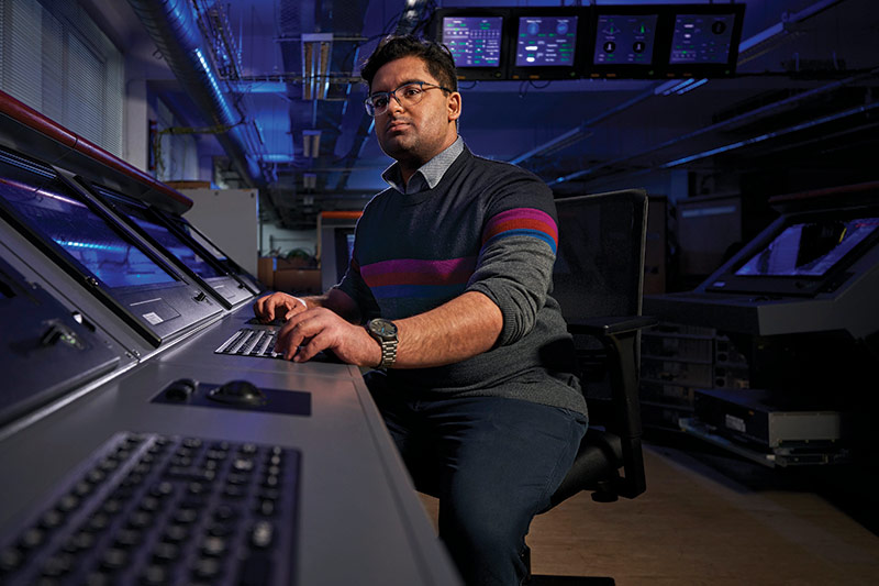 man working on ship navagation system