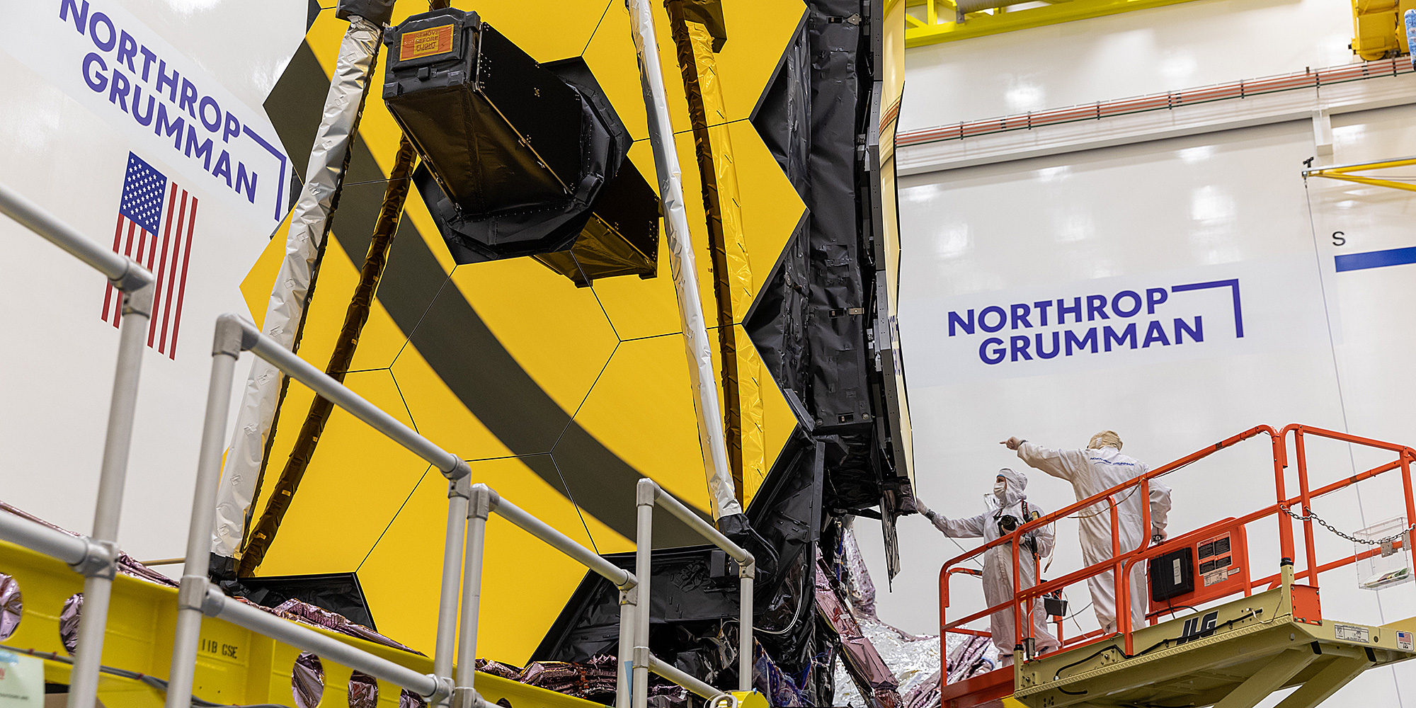 technicians working on James Webb Space Telescope in cleanroom