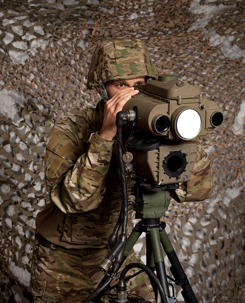 Lightweight Laser Designator Rangefinder AN/PED-1 military man viewing into laser rangefinder