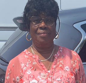 woman standing next to car