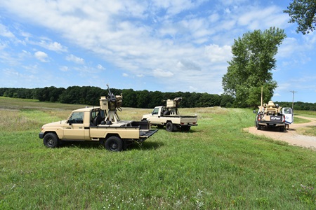 A picture of a vehicle in a green field with the M-ACE capability.