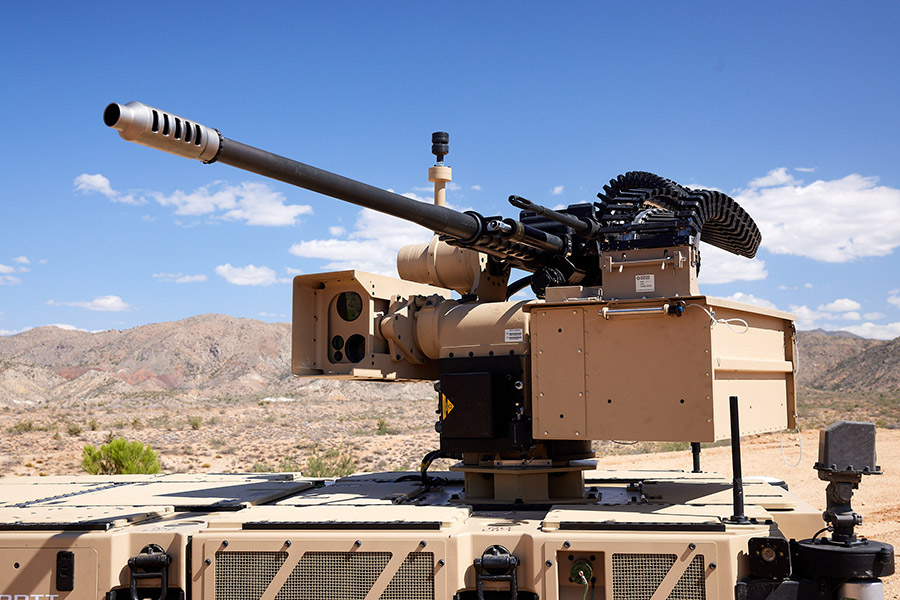 large military gun mounted on a truck