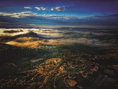 Northrop Grumman manager volunteers in Vietnam Foggy Mountains and beautiful sunrise in Da Lat