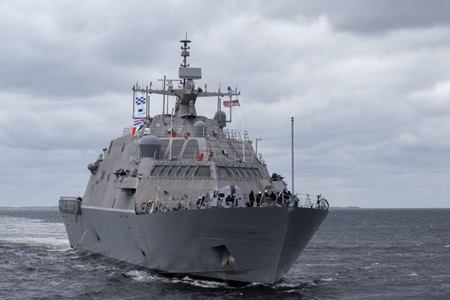 Military ship sailing through the ocean