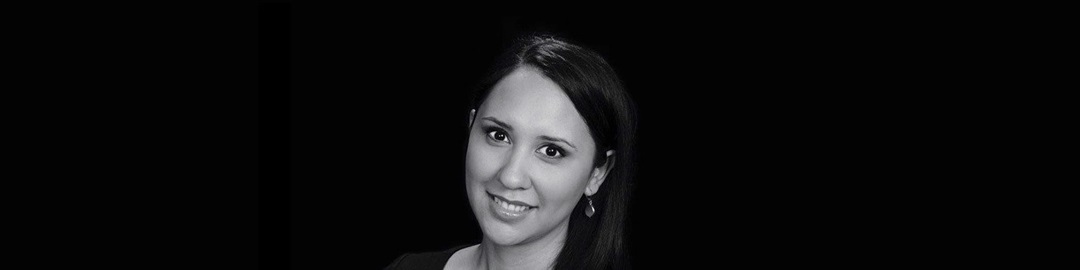 black and white headshot of woman smiling