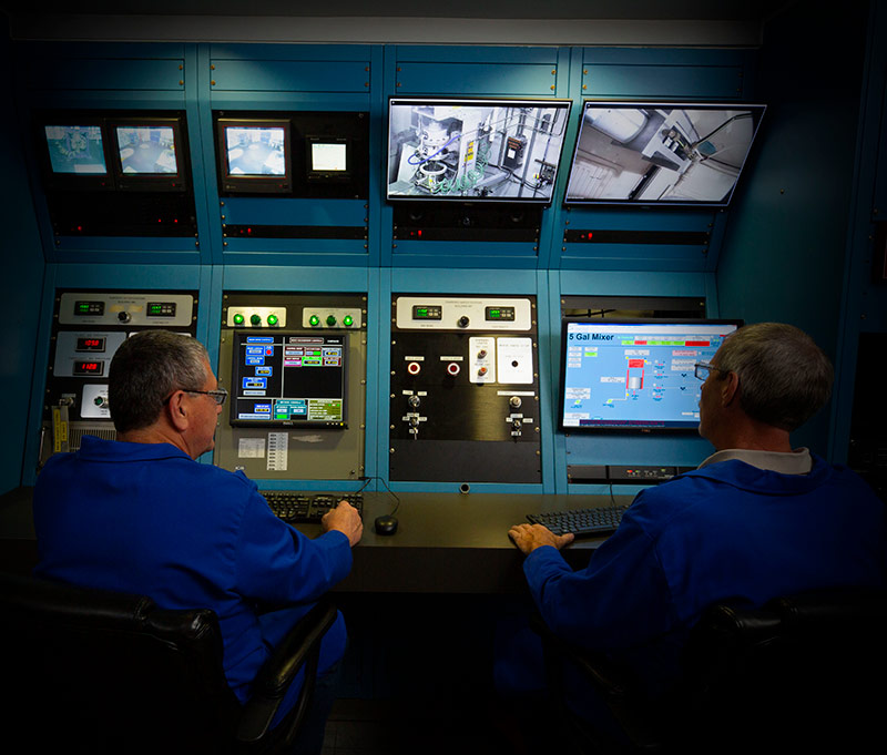 two men at rocket testing room