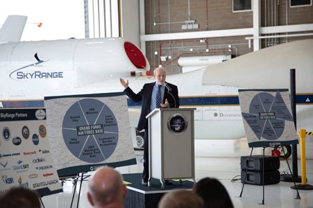 male standing in front of RangeHawk at press conference