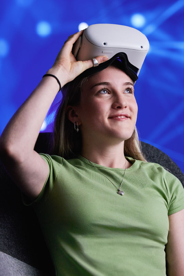 STEM Female putting on VR goggles