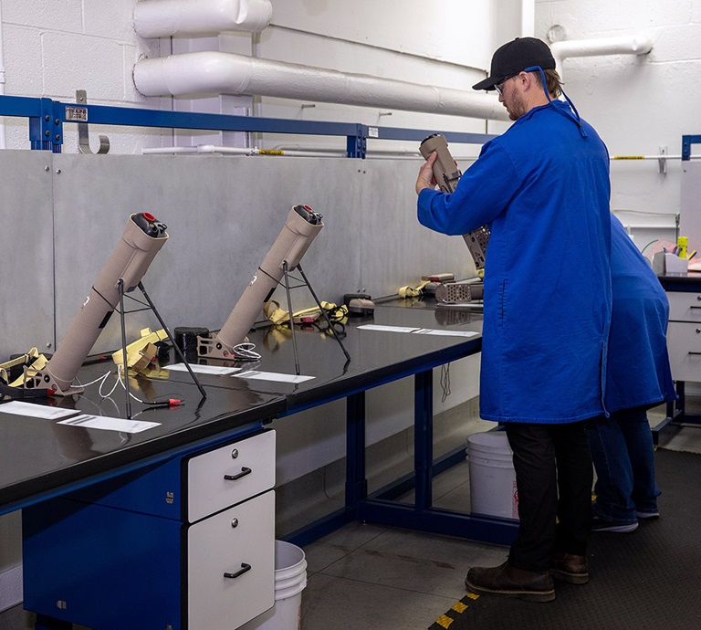 Switchblade two technicians working in a lab