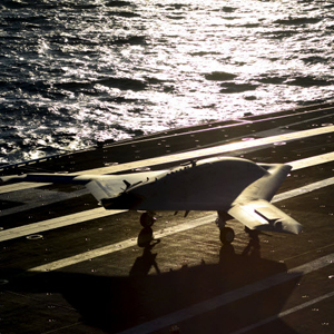 X-47B on the runway on aircraft carrier