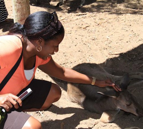 woman petting kangaroo