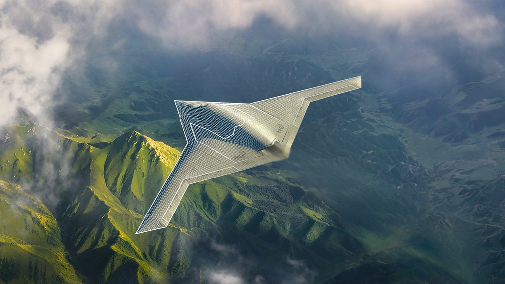 Miliatary aircraft flighing over green mountainous landscape